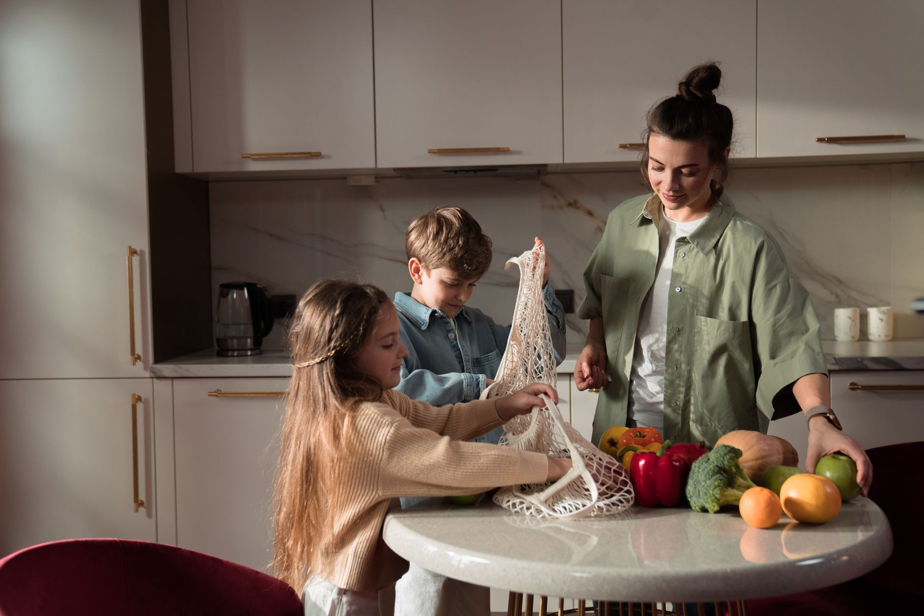 A happy family of three enjoying quality time unpacking vegetables in a modern kitchen. — 5 Methods To Improve Your Dating Ex