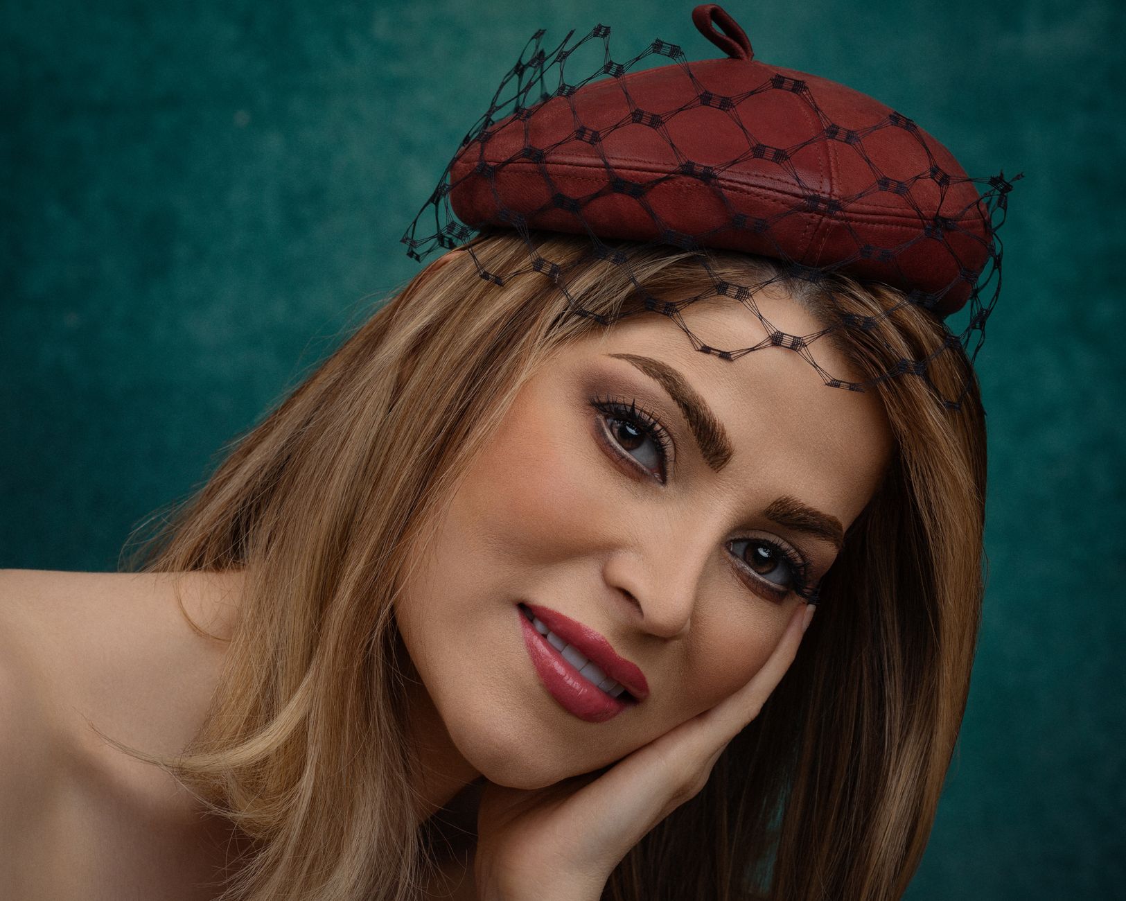 Sincere female in modern elegant hat with veil touching face while looking at camera — Beautiful Female Physiques - The Five