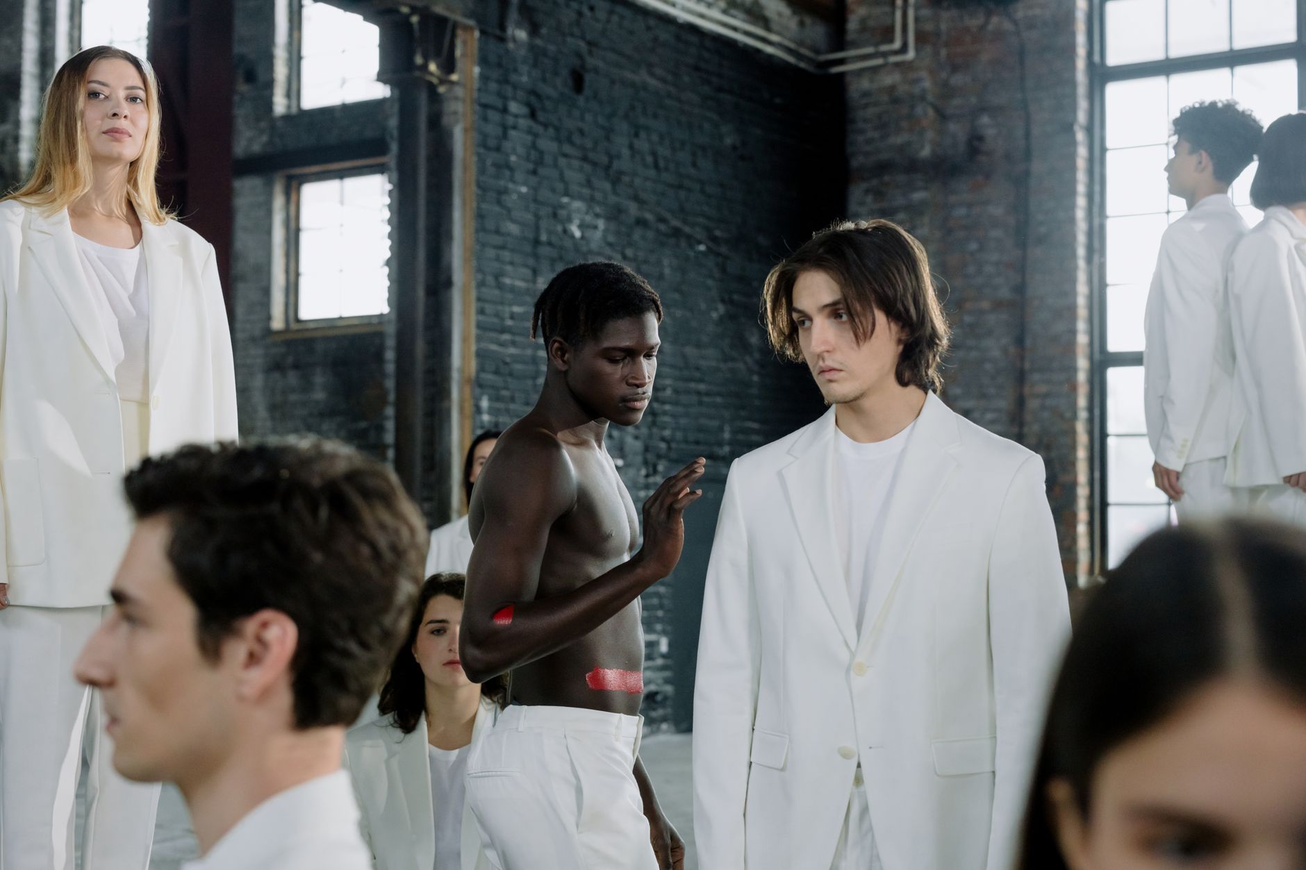 Models in a fashion shoot wearing white outfits in an industrial space. — Bess Dress Ideas for Women