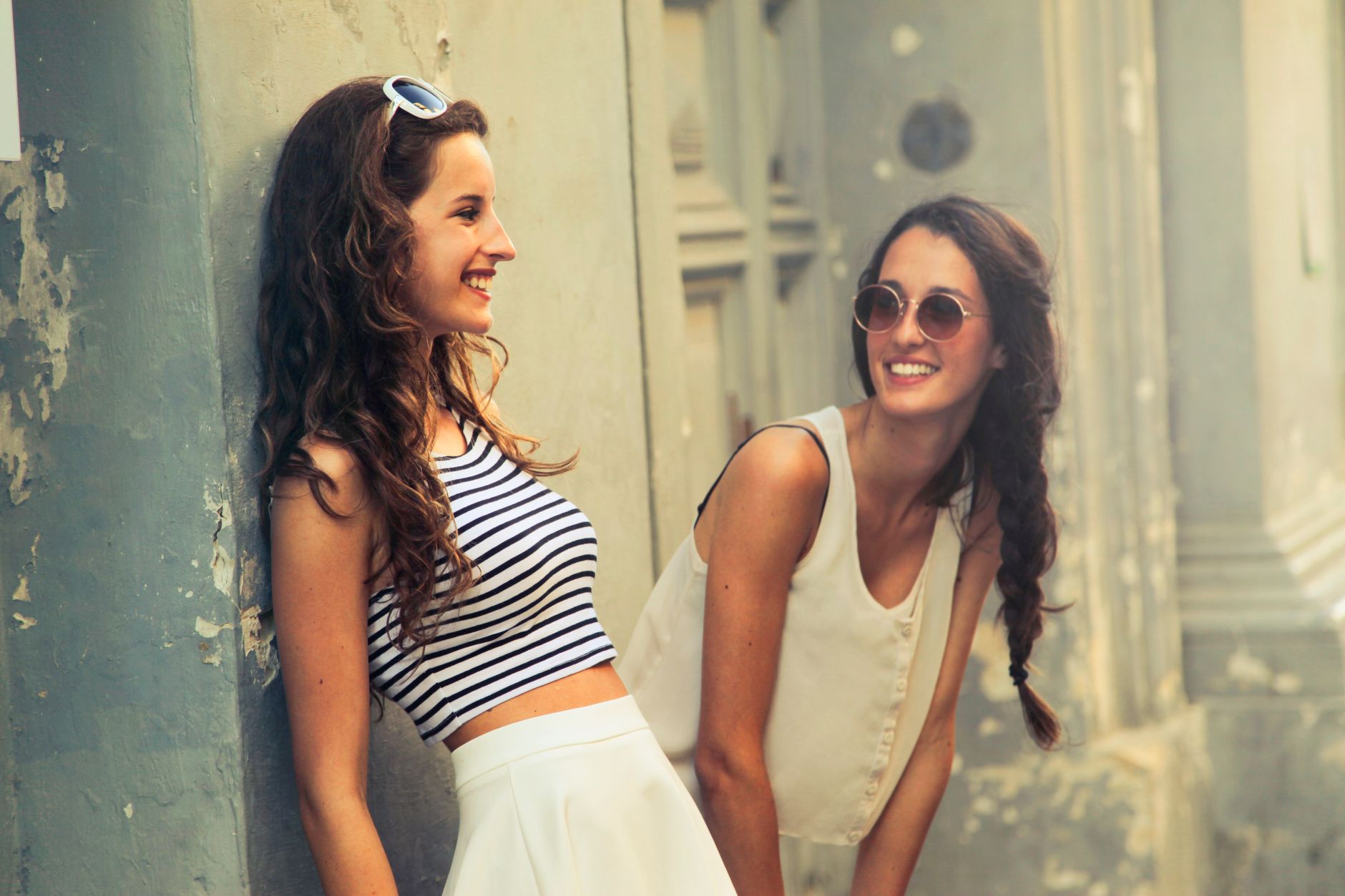 Two young women smiling and posing outdoors in Valletta, Malta. — Do You Want To Buy A Perfect Leather Wallet?