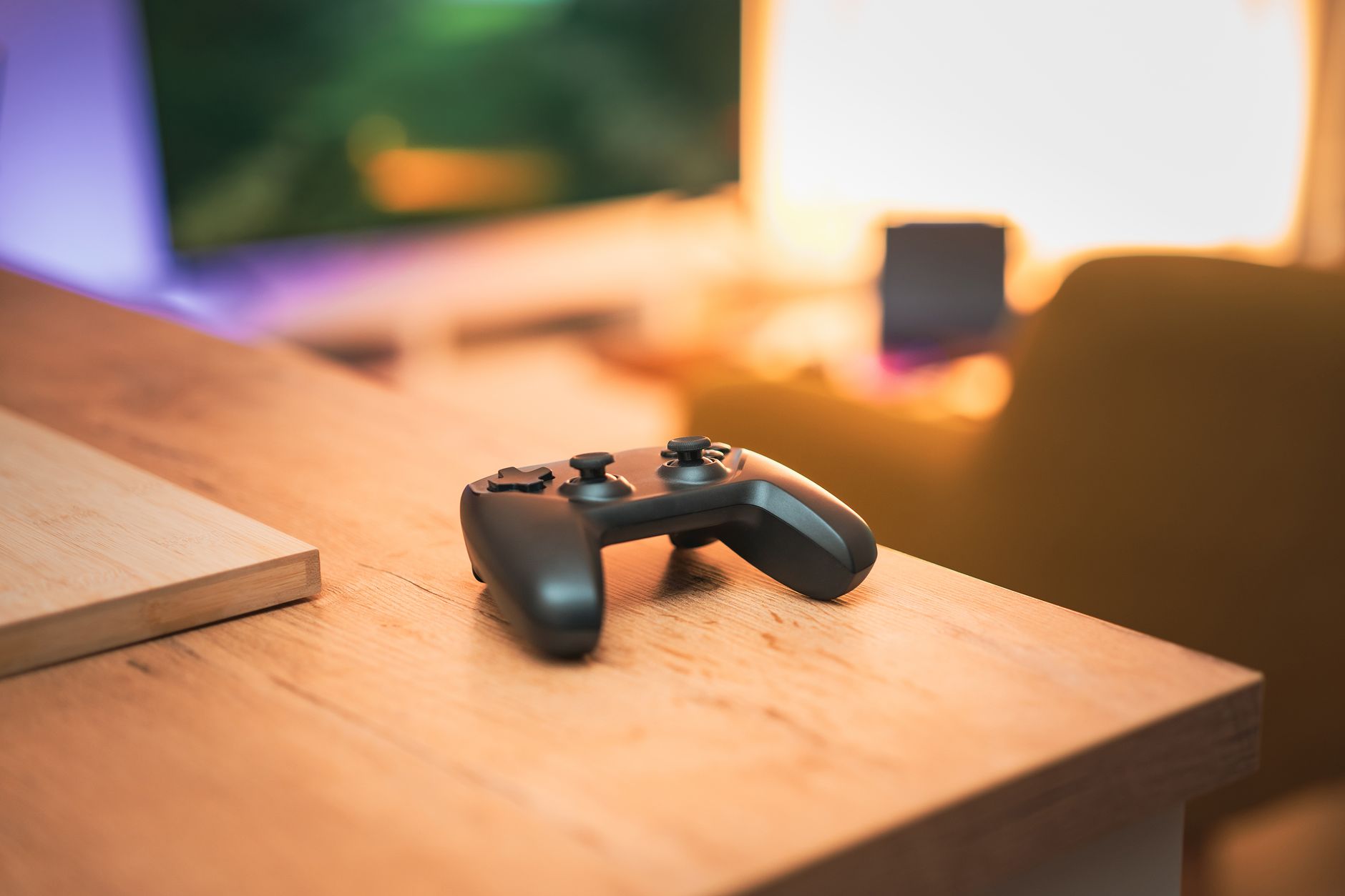 A cozy indoor scene with a video game controller on a desk, perfect for gaming enthusiasts. — Strike it Big with PG Slot Mach