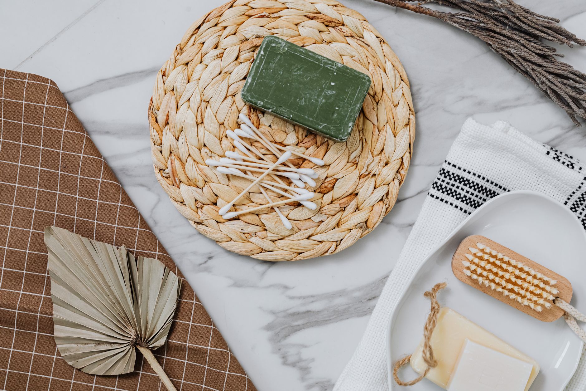 Flat lay of eco-friendly bathroom essentials on marble with natural elements for a spa-like feel. — What Is a Hair Conditione